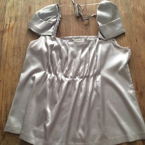 Platinum colored top with puff cap sleeve.